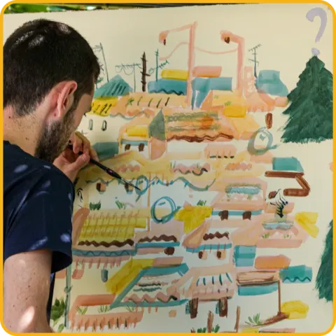 Um homem a pintar com pincel um grande desenho colorido de uma cidade.